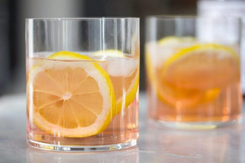 Two citrus-garnished drinks, serving inspiration